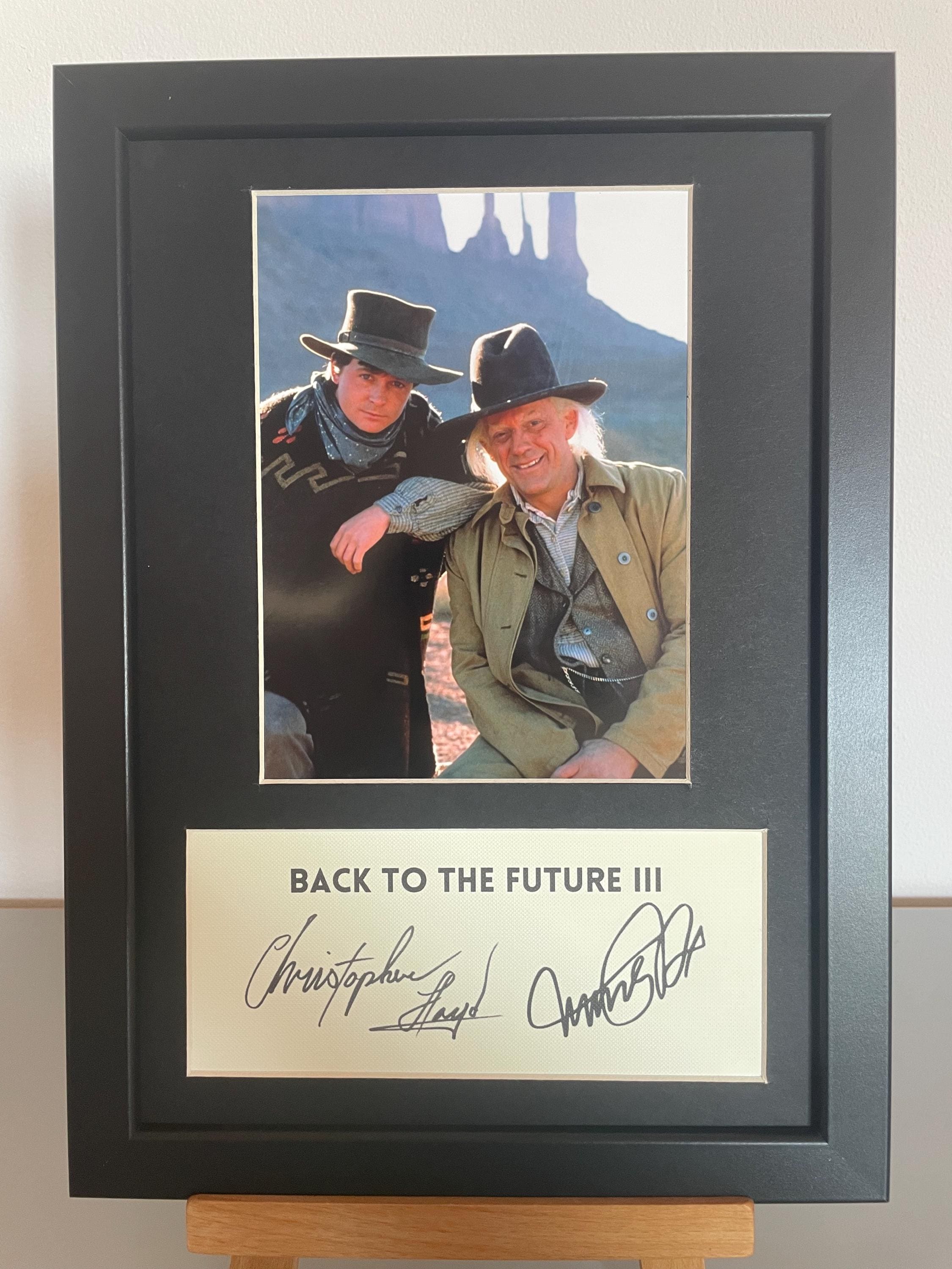 クリストファー・ロイドとマイケル・J・フォックスのサイン入りA4
