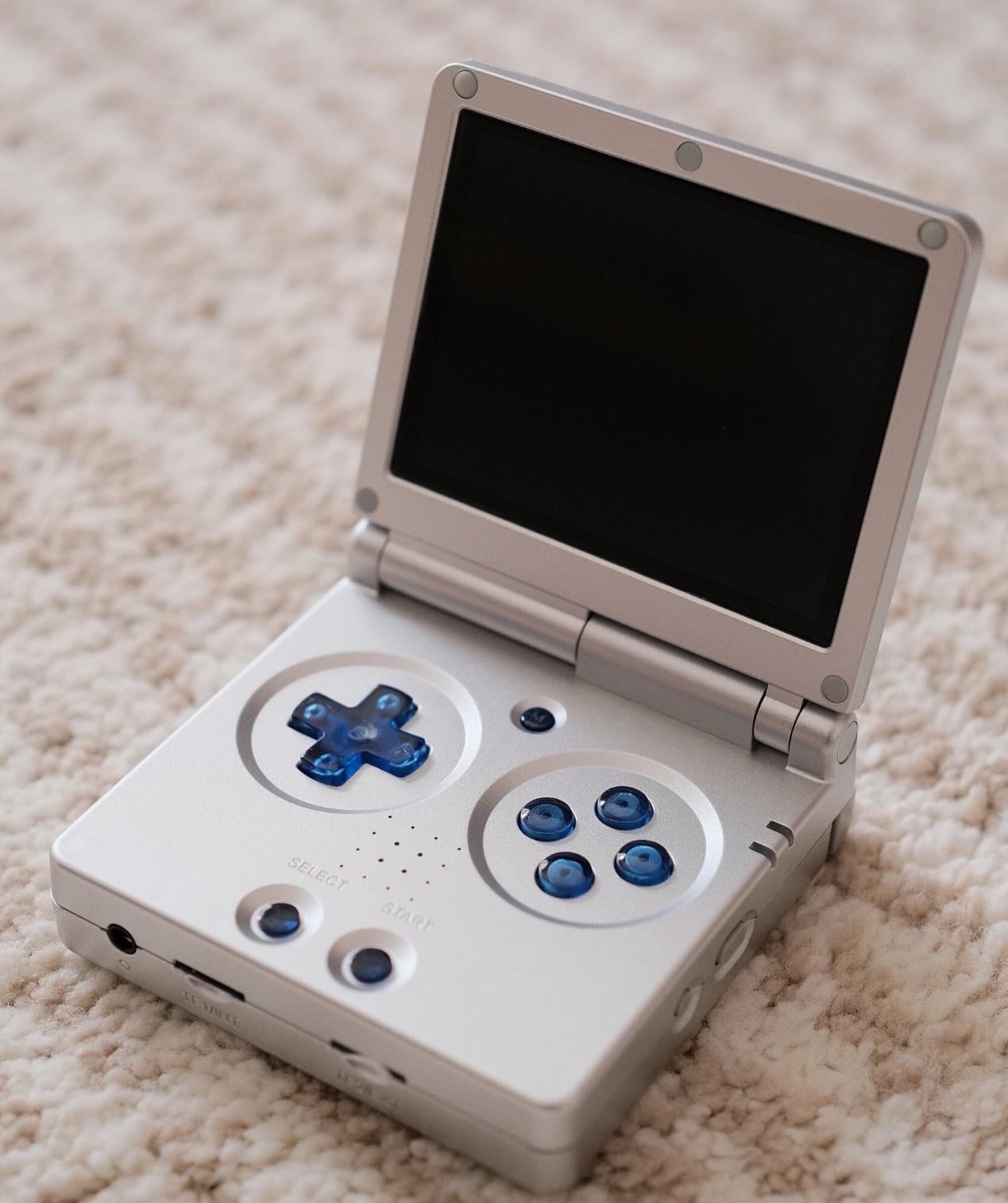 I made transparent blue buttons for RG35XX SP. It may look better