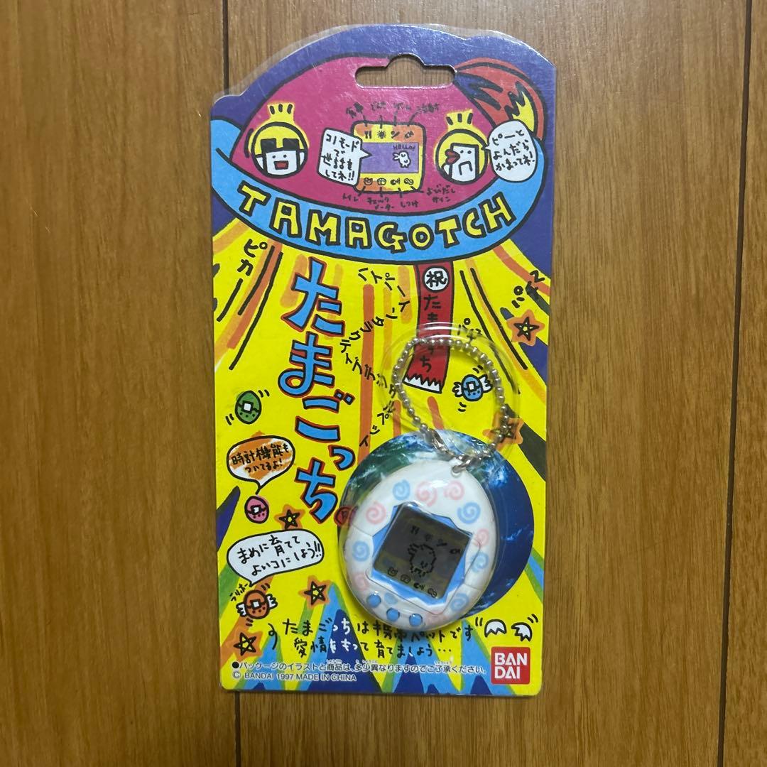 新品 未開封 初代 たまごっち 白 うずまき - メルカリ